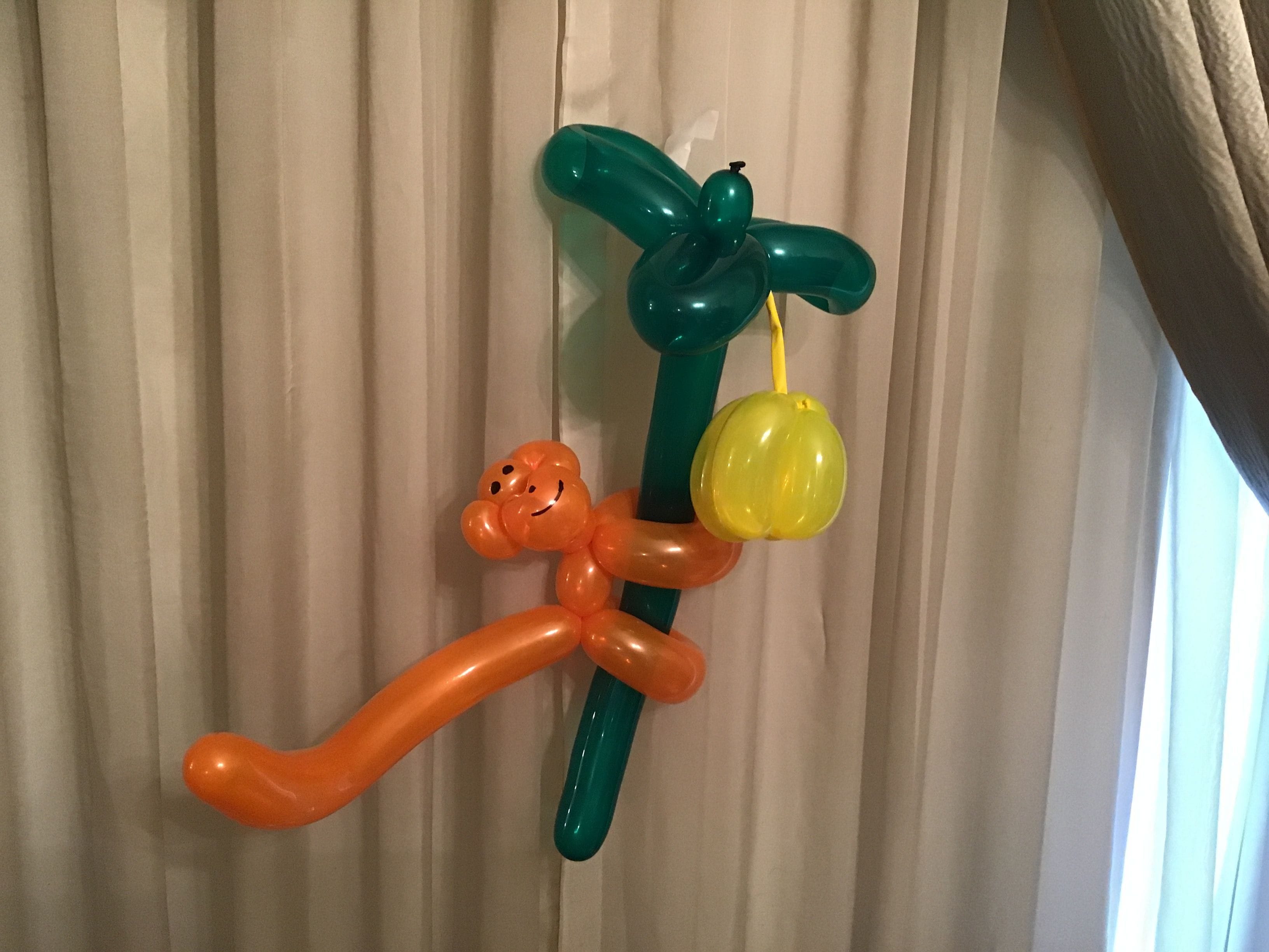 balloon animal monkey in a tree